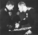 Командующий Северным флотом адмирал А. Г. Головко вручает награды отличившимся в боях